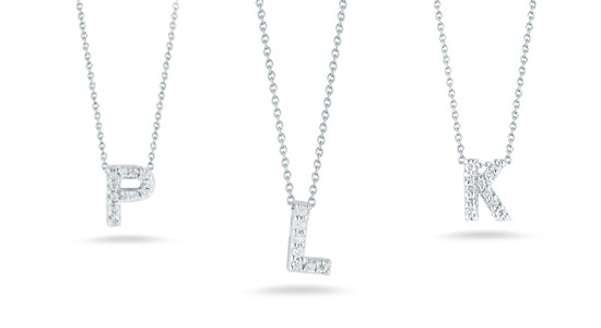 Three white gold and diamond initial pendant necklaces from Roberto Coin, available at Kirk Jewelers.