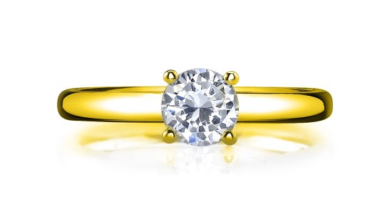 a yellow gold solitaire engagement ring with a round cut center stone