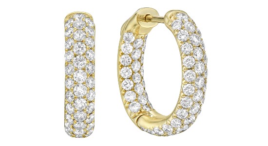 A pair of yellow gold huggie earrings with pavé set diamonds, available at Kirk Jewelers.