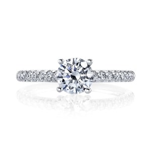 A side stone engagement ring with comfort fit features.