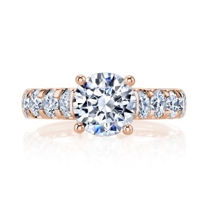 A 18k rose gold cathedral setting engagement ring.